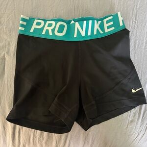 Black Nike Pro shorts w/ turquoise waistband